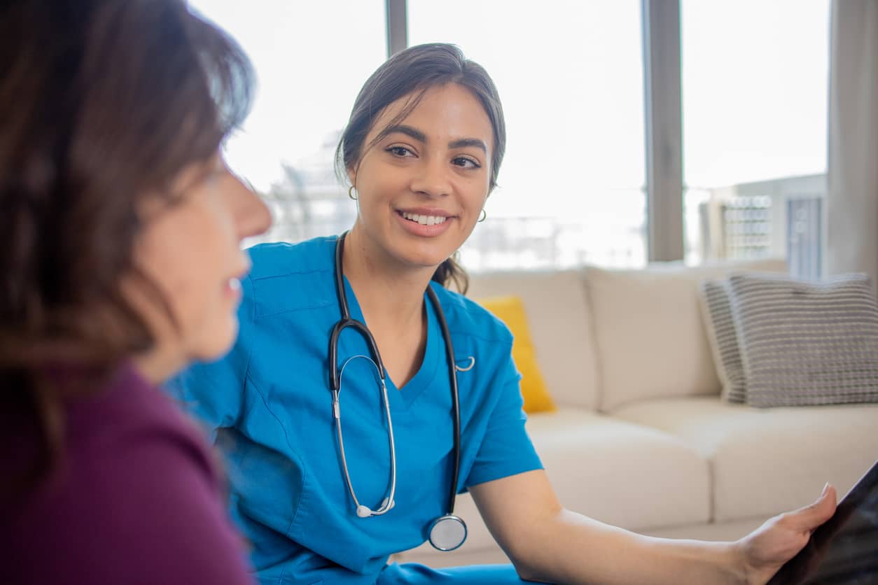 engaged caregiver talks with woman