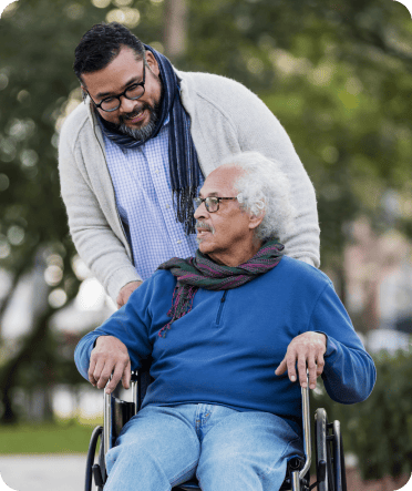 quality caregiver walks client in wheelchair