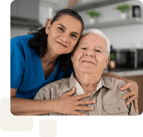 worker-owner hugs elderly client